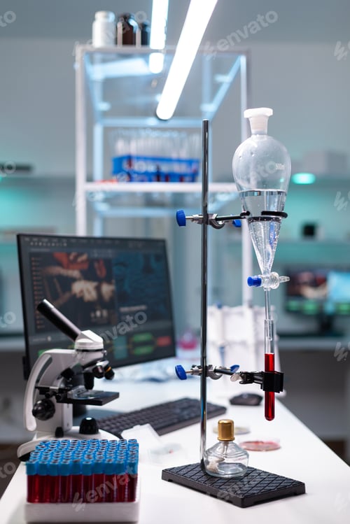 Preview: Science laboratory equipment and test tube with blood