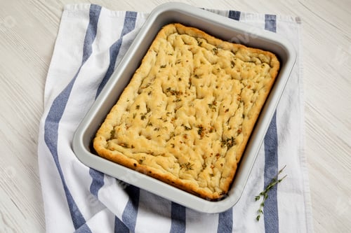 Preview: Home-baked Rosemary Garlic Focaccia Bread, side view.