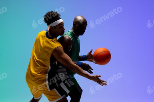Preview: Image of two diverse basketball players with basketball playing on purple to green background