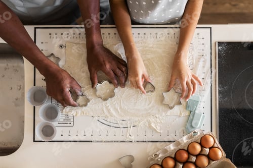 Preview: Black Father And Daughter Cutting Out Different Cookie Shapes Of Dough