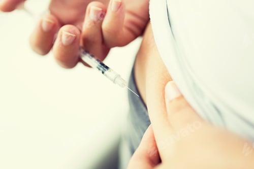 Preview: woman with syringe making insulin injection