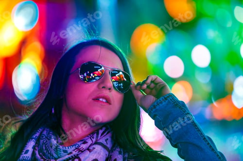 Preview: Stylish young woman near illumination on street