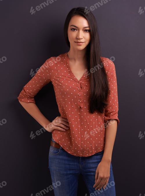 Preview: Shes got your attention. A pretty young woman looking at the camera.