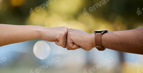Preview: Hands, motivation and fist bump with people outdoor on a blurred background for unity or solidarity