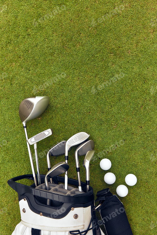 Preview: Golfing Equipment Spread Out on the Lush Green Turf Featuring Various Clubs and Balls Used for Play