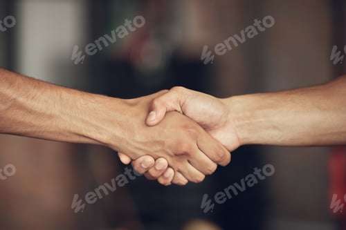 Preview: Closeup on hands of athletes handshake in the gym. Two bodybuilders greeting before workout togethe