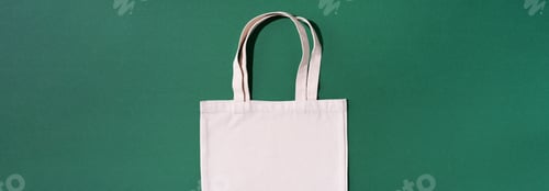 Preview: Canvas tote bag canvas and linen fabric bags with drawstring on green background with copy space