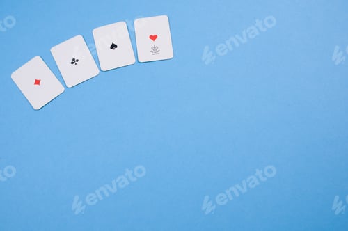 Preview: Top view of four playing cards isolated on a blue background