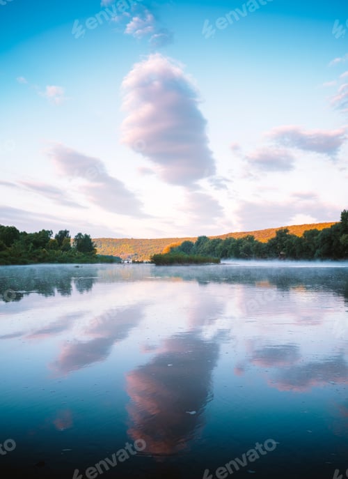 Preview: Majestic foggy river and lush autumn forest at sunrise time