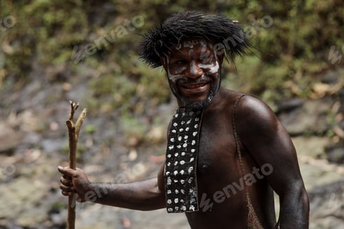 Man Smiling with Decorative Dress in Forest