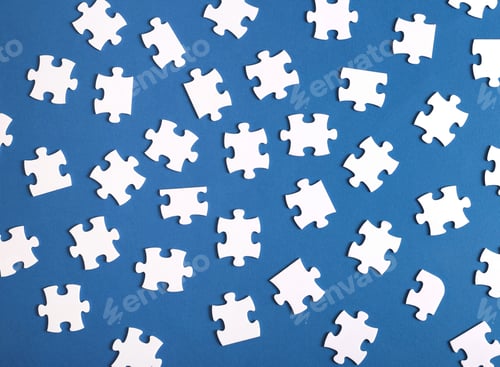 Preview: Many scattered puzzles on blue background top view