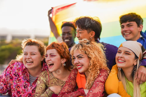 Preview: Group of multiracial young people having fun together at gay pride parade outdoor