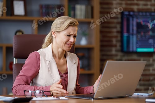 Preview: Stressed female trader desperate about losing money analyzing stock exchange market. Tired
