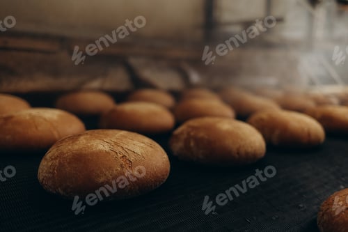 Preview: A lot of bread prepare to move on in the shelf. Bread bakery food factory production with fresh