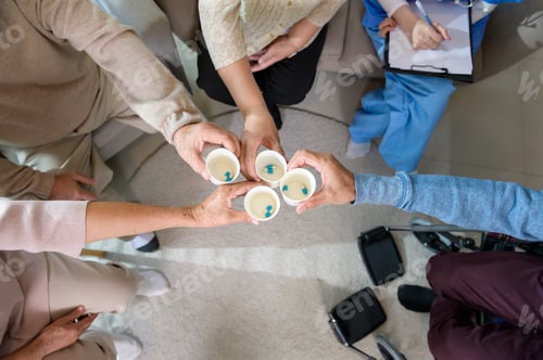 Preview: Top view of Seniors people holding pill or vitamin supplement