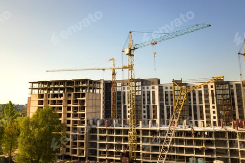 Preview: High multi storey residential apartment buildings under construction. Concrete and brick framing of