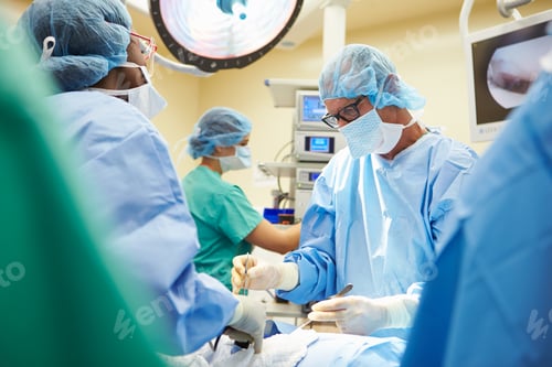 Preview: Surgical Team Working In Operating Theatre