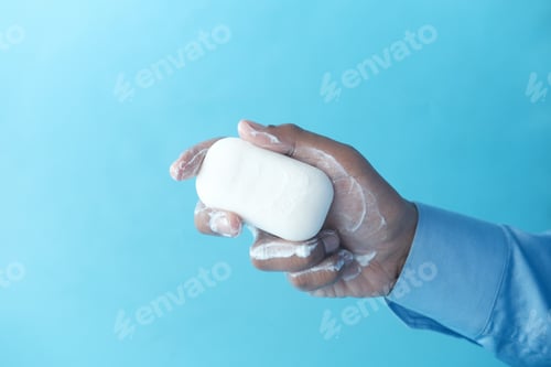 Preview: young man washing hands with soap warm water