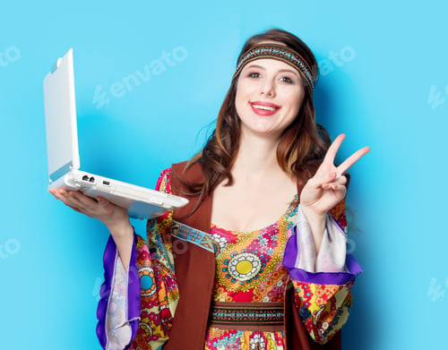 Preview: Portrait of Young hippie girl with laptop computer