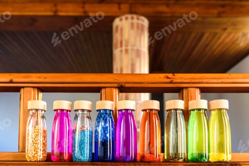 Preview: Collection of bottles of calm, plastic with wooden stopper, toy filled with liquids and materials