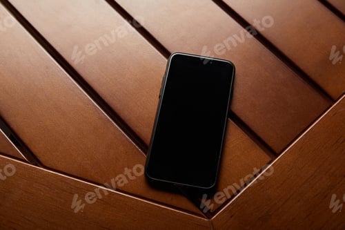 Preview: top view of smartphone with blank screen and copy space