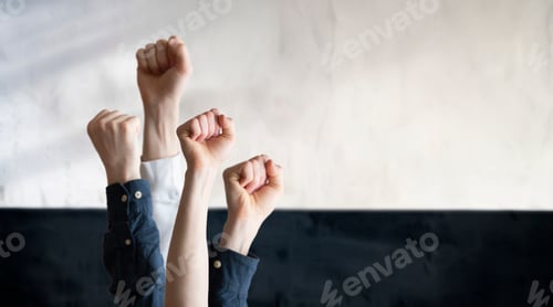 Preview: the people with raised hands fists in the air, as symbol of protest for equality. freedom.