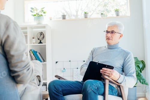 Preview: Professional psychotherapy. Male psychologist having session with patient at mental health clinic,