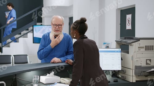 Preview: African american receptionist helping injured patient with cervical collar
