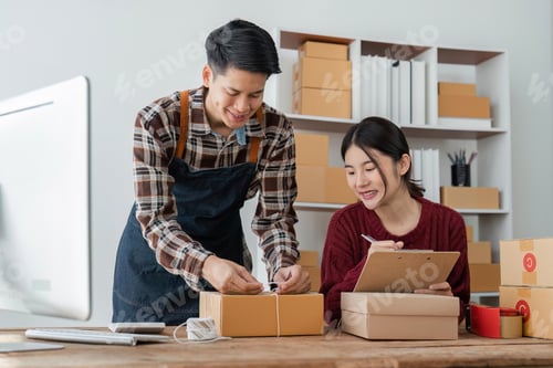 Preview: startup small business owner working with computer at workplace. freelance man and woman seller