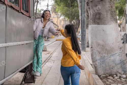 Preview: Woman from tram wagon tries to shake hands with friend