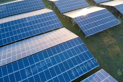 Preview: Aerial view of large sustainable electrical power plant with rows of solar photovoltaic panels