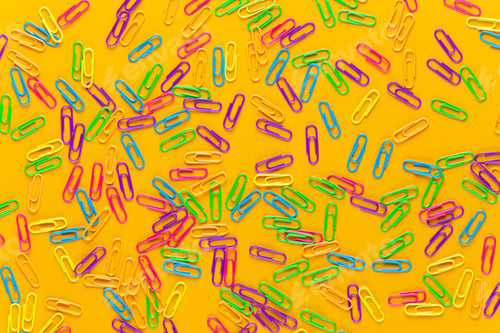 Preview: Paper color clip notebook on yellow background. Flat lay.