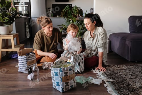 Preview: Family with child sorting garbage