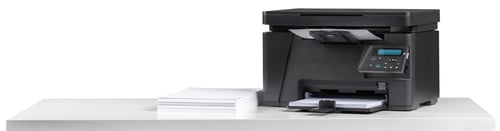 Preview: Printer on a white table with a stack of paper beside it for printing tasks