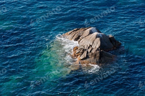 Preview: Waves on rocky beach, sea shore with waves crushing over the big rocks