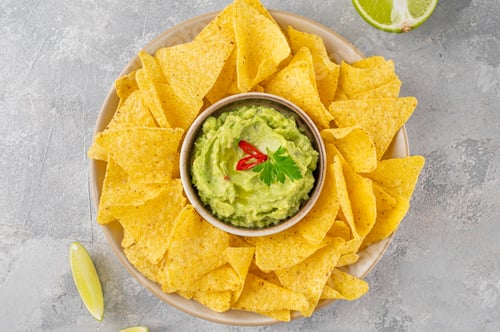 Preview: Mexican Nachos chips and dip sauces. Tortilla corn nachos chips with tomatoes salsa and guacamole.