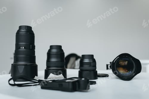 Preview: different lenses and light meter in photo studio