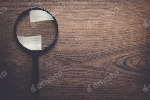 Preview: magnifying glass on wooden background
