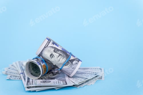 Preview: Stack of One Hundred Dollar Bills on Blue