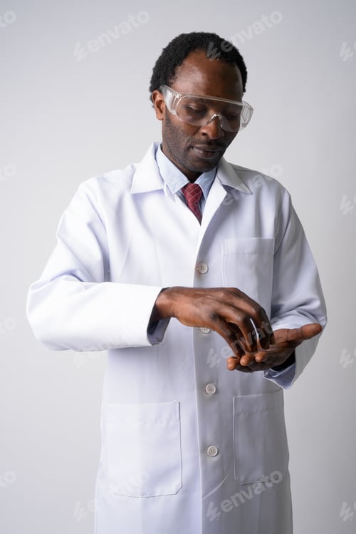 Preview: Portrait of African man doctor with protective glasses