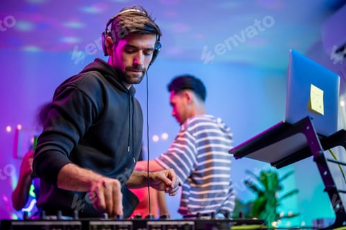 Preview: Caucasian young man artist DJ mixing and scratching music mixer controller.