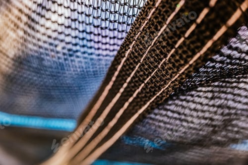 Preview: A black nylon mesh in the field to protect yourself from birds and insects.