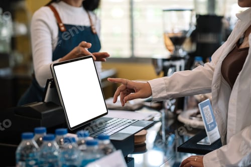 Preview: Small business owners serve their customers through a tablet app at the coffee shop.