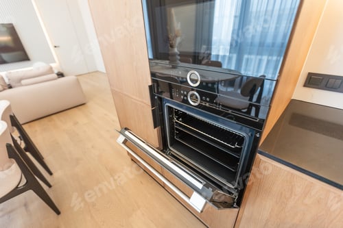 Preview: modern kitchen perfectly equipped with its appliances in a house