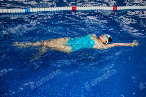 Preview: woman swimmer swims in a swimming pool, water sports