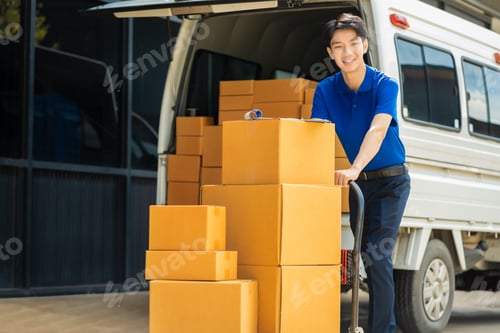 Preview: Asian delivery man work in truck for checking the product in the truck, concept ecommerce.