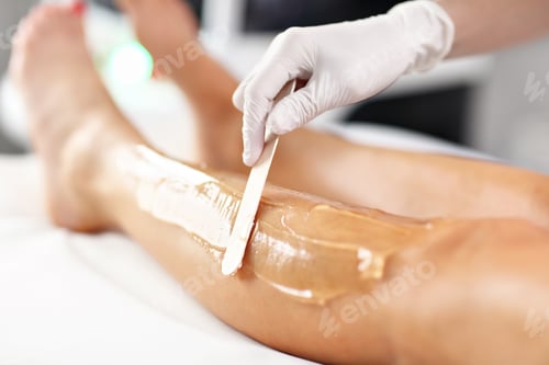 Preview: Beautician Giving Epilation Laser Treatment To Woman On Legs