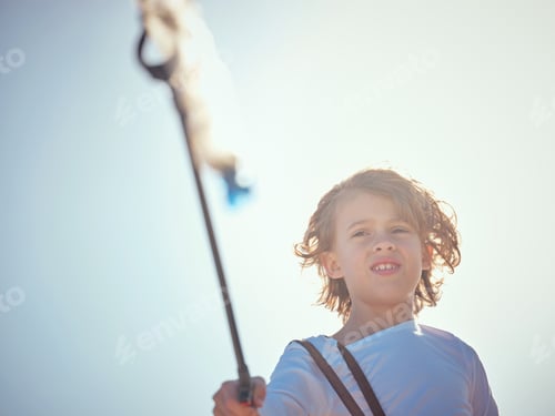 Preview: Cute preteen boy with trash grabber and plastic bottle