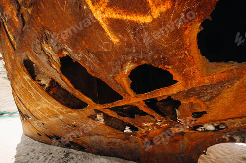 Preview: Rusted with holes, the ship is on the sea shore.Rusty ship in the Bay of Navagio on the island of