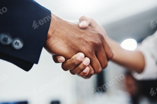 Preview: Closeup shot of a handshake between two unrecognizable people at the office